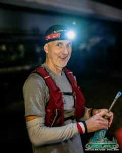 Jim at Mamba aid station at night